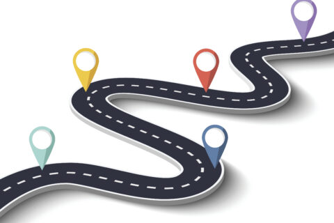 Une route sinueuse, et sur cette route plusieurs symboles de points d'étape